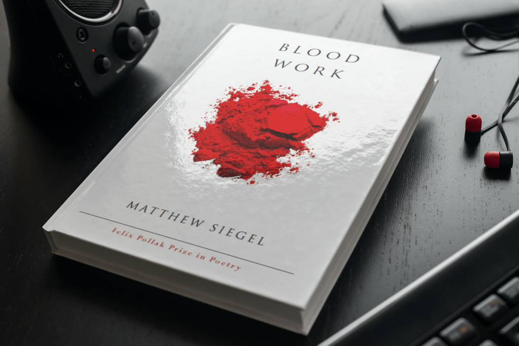 mockup-of-a-hard-cover-book-on-a-table-with-gadgets-3407-el1 (1)
